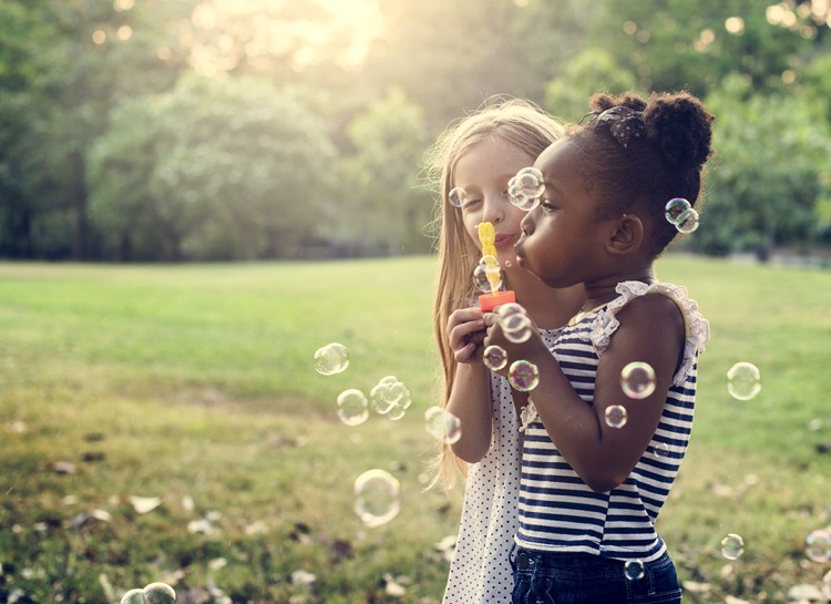 Girls blowing bubbles