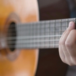 Close up of a guitar player