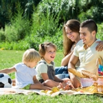 A young family enjoying a picnic